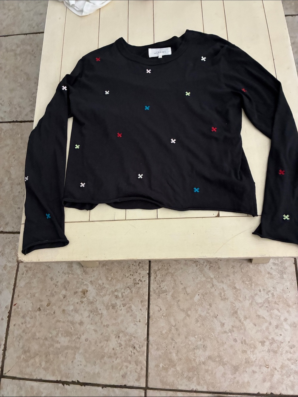 The Great is the label on this long sleeve tee..
